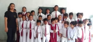 kids stands in school with volunteer Aapke Saath Foundation after Art Competition