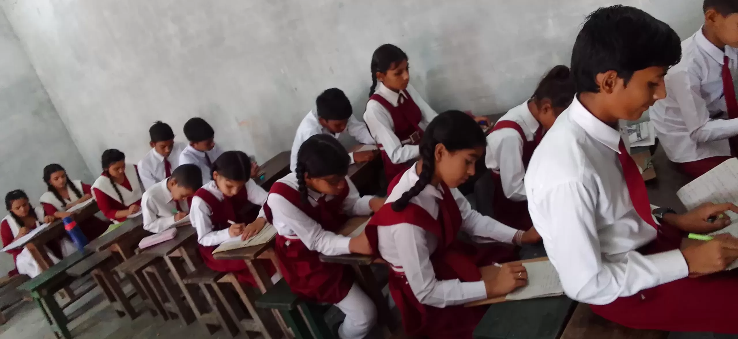 children giving exam 