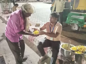 a old poor man taking food from volunteer of aapke saath foundation ngo