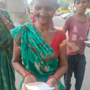 a lod lady have food from food distribution camp