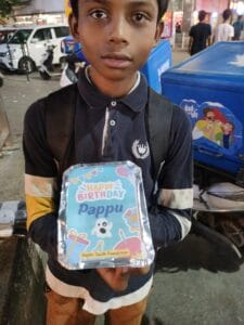 Volunteers serving food to homeless on a birthday event