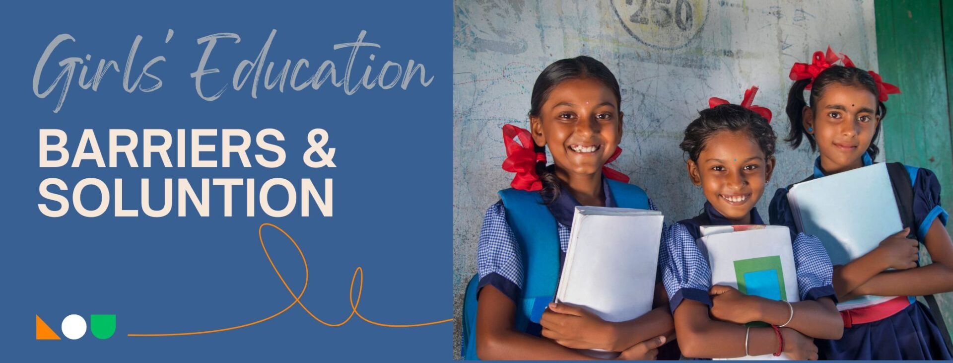 Three smiling girls holding books and notebooks, representing the article 'Barriers to Girls' Education in India.