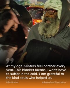 An elderly man gratefully accepts a cozy blanket from a volunteer, bringing warmth and comfort during the winter season
