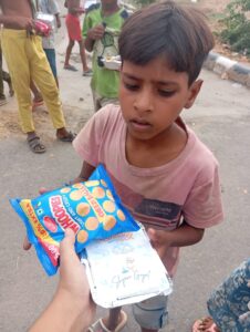 distributing food to the needy children on birthday