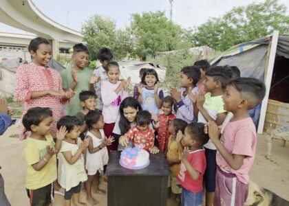 Excited poor children celebrating birthday by cutting cake during donation drive — donate birthday cake for needy kids, sponsor birthday for poor children, celebrate birthday with underprivileged kids