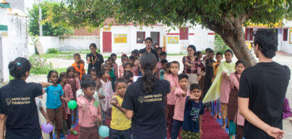 Volunteers giving motivational speech to school children in Bareilly village school